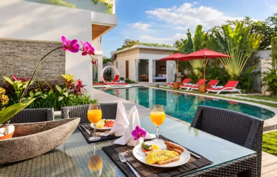 Breakfast by the swimming pool at Villa Miro with pool and daybed views