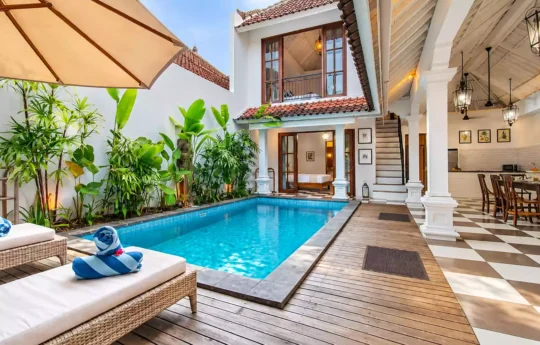 Villa Kailysa Indah Seminyak swimming pool and living area views with garden on side